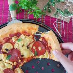 Stuffed Crust Pizza - pulling crust to show cheesy filling