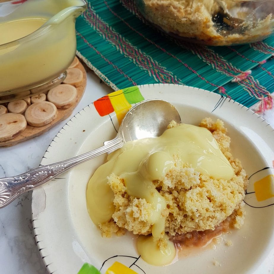 Portion of Gluten Free Gooseberry Crumble with custard