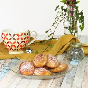 English Lavender Madeleines served on a plate with a cup of tea