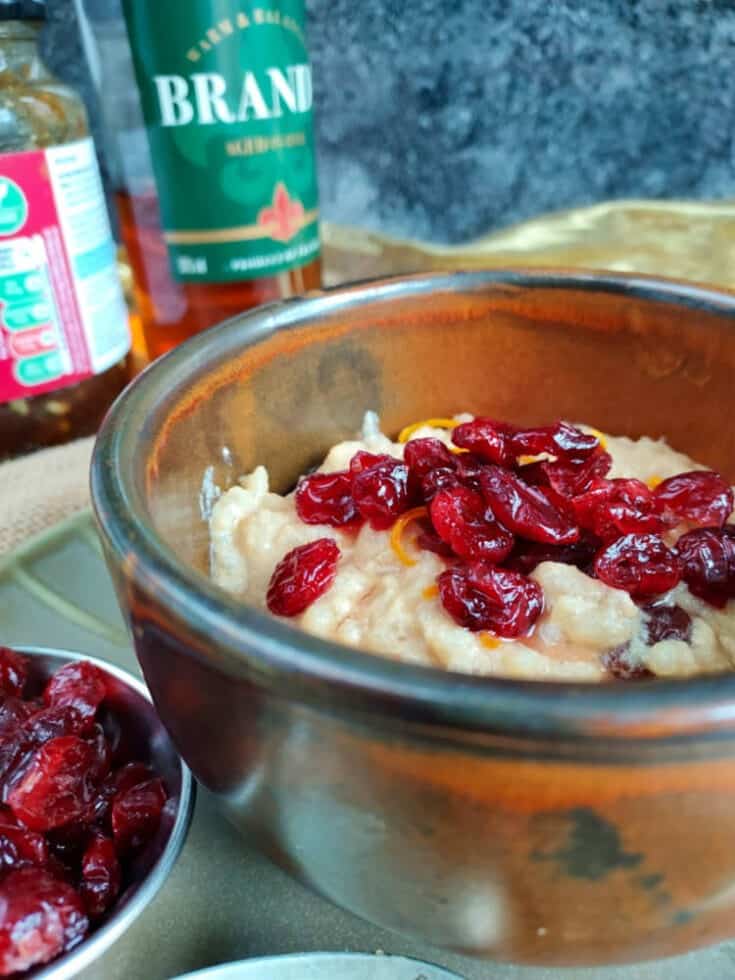 Festive Rice Pudding made with mincemeat and topped with brandy soaked cranberries