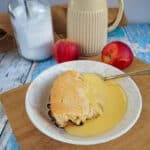 Mincemeat and Apple Eve's Pudding and custard served up in a retro bowl with a jug of custard in the background